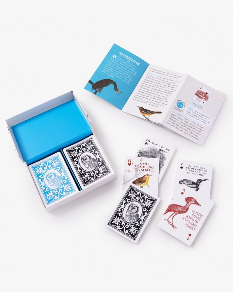 an open box of Effin’ Birds playing cards, showing the card fronts and backs plus the instructional insert.