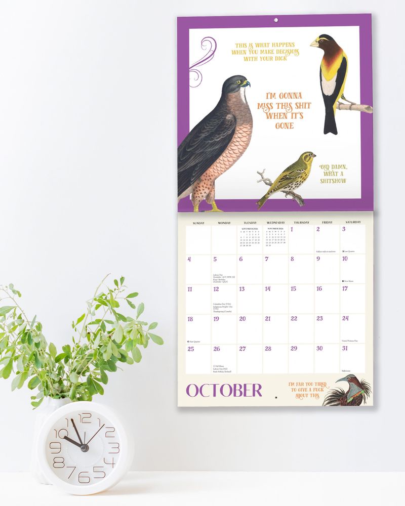an Effin’ Birds calendar hanging on the wall. 