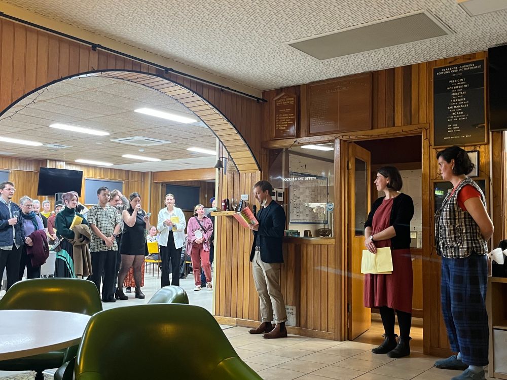 Alex Cothren reads from his new collection, Playing Nice Was Getting Me Nowhere, during the launch at an old school bowls club.