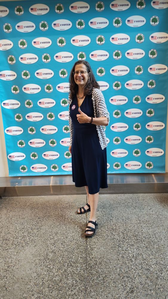 Me (middle-aged white lady) in front of the "I voted" sign at Ann Arbor City Hall