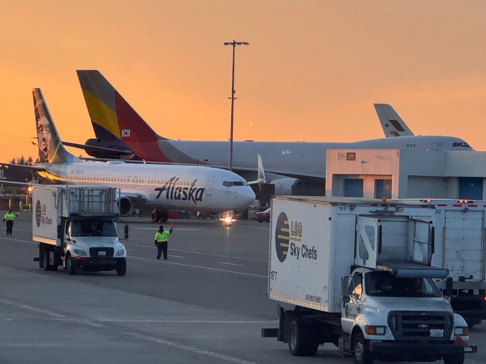 An air asiana 747 cargo plane making the smaller planes taxiing in front of it look puny 