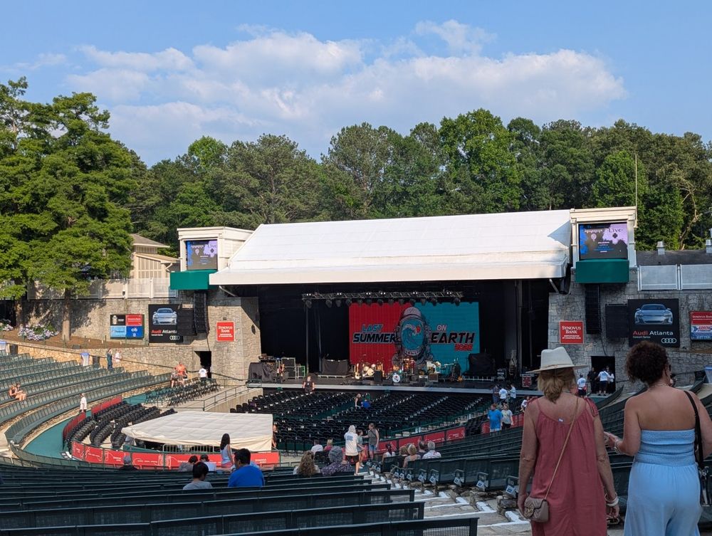 view from our seats at Chastain Amphitheater. The stage is in the background setup for the first opening band. Show is still 40m away so seats are empty for now