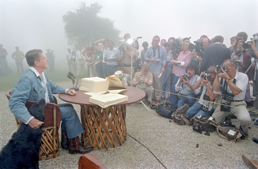 President Ronald Reagan meets with the Press after signing the 1981 Tax Reconciliation Bill at Rancho Del Cielo. It’s foggy