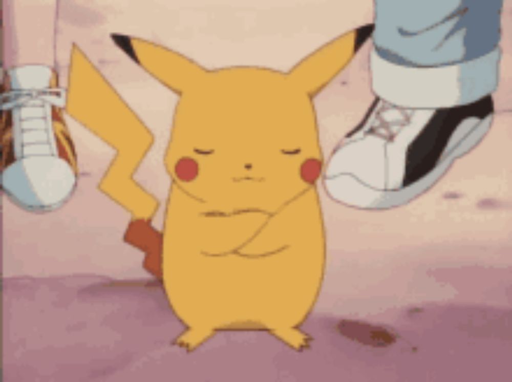 a pikachu is standing next to a pair of shoes