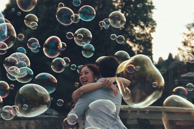Bubbles and two people hugging. 