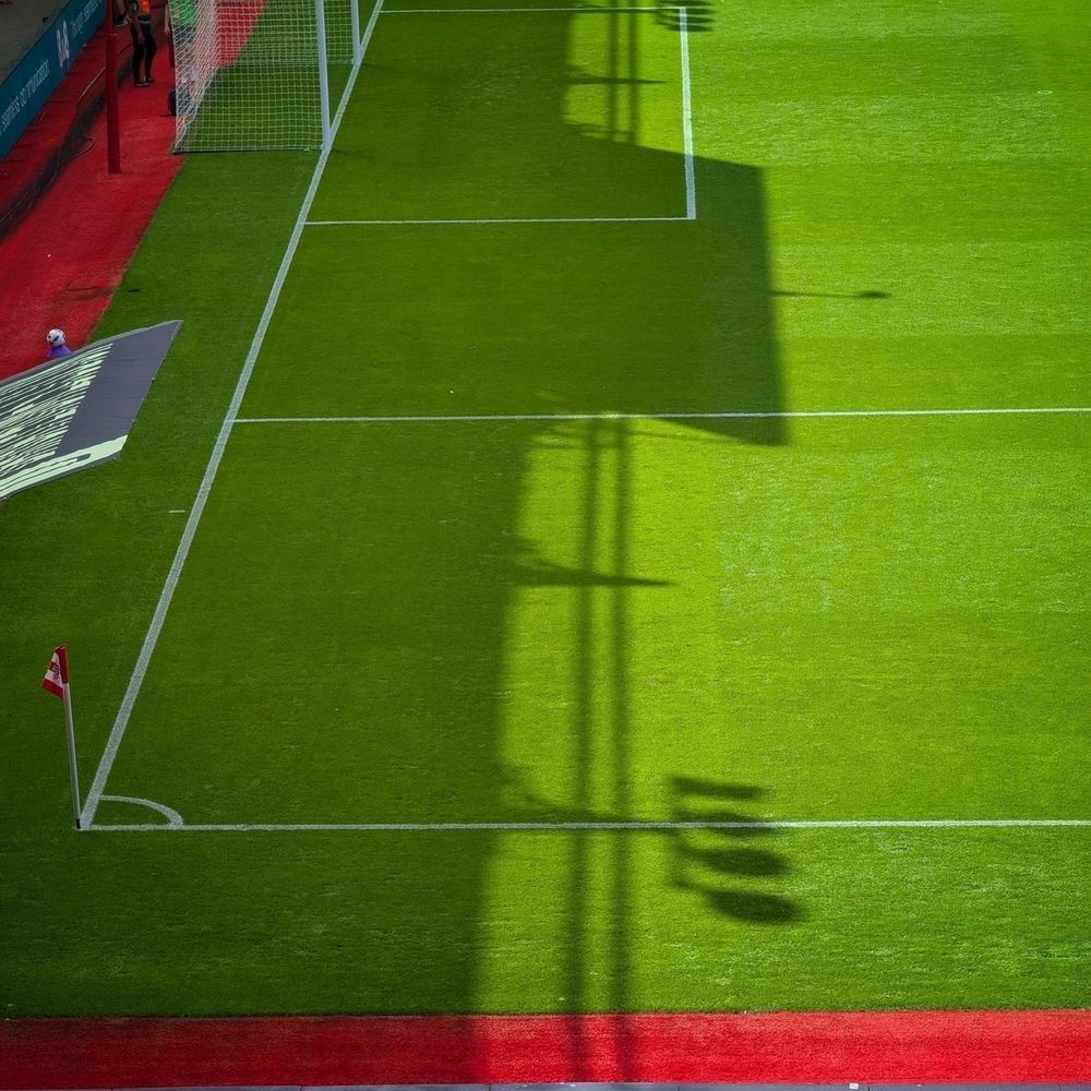 The Chapel stand casts a strong shadow across the St Mary’s pitch which is otherwise bathed in sunlight.