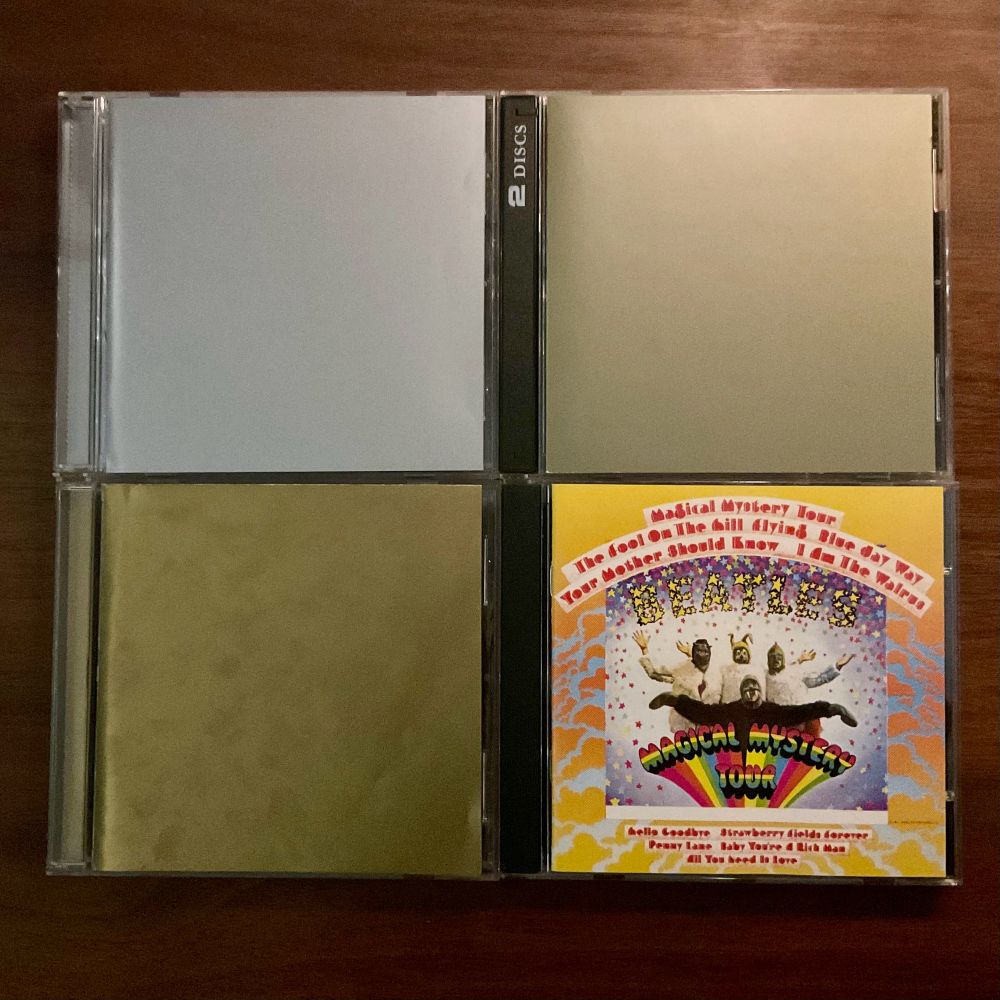 4 cd cases arranged in a grid - Faust - Rien; Autechre - tri repetae++; Gastr del Sol - The Harp Factory on Lake Street; The Beatles. - Magical Mystery Tour