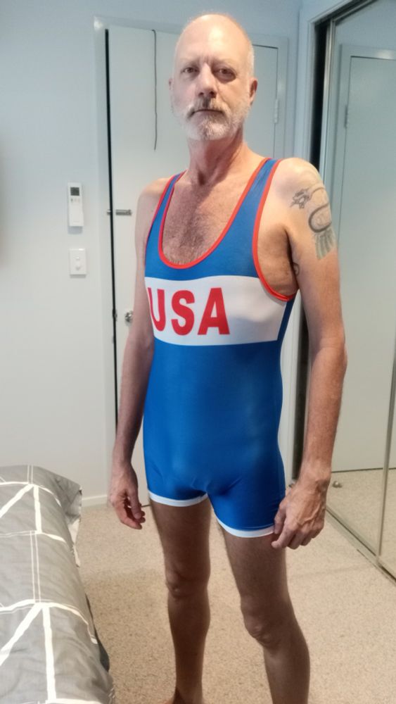 Cute older bottom guy in tight fitting replica USA national wrestling singlet 