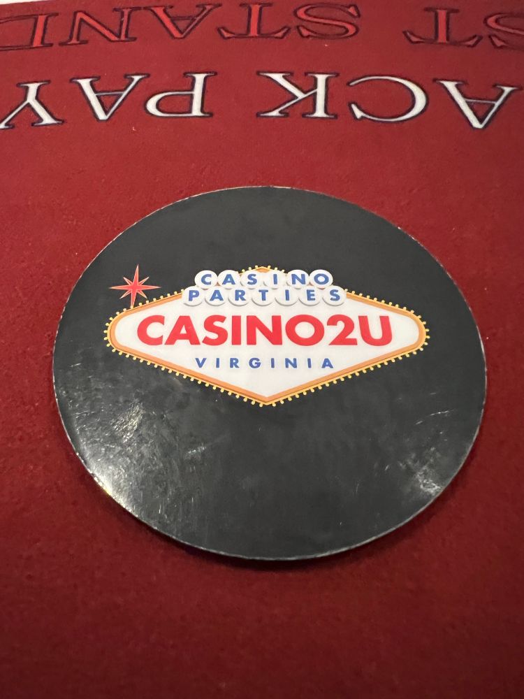 Casino2U coaster on a red blackjack table