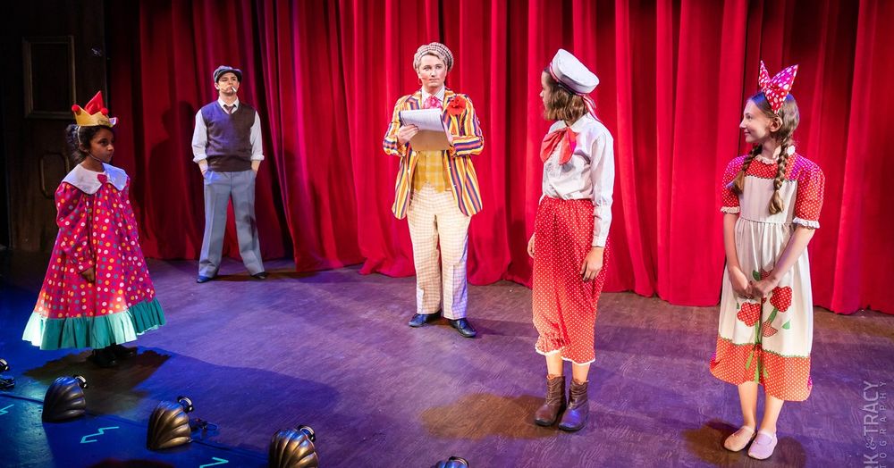 Me as Uncle Jocko in the musical Gypsy, performed in September 2022. Photo of a man in checkered pants, a plaid patterned vest, black shoes, and a very colorful striped jacket, with stripes of yellow, blue and red all over. There’s also a flower on the jacket lapel. He’s wearing an ascot and a old timey hat with very vaudevillian makeup.

He’s also holding a clipboard.