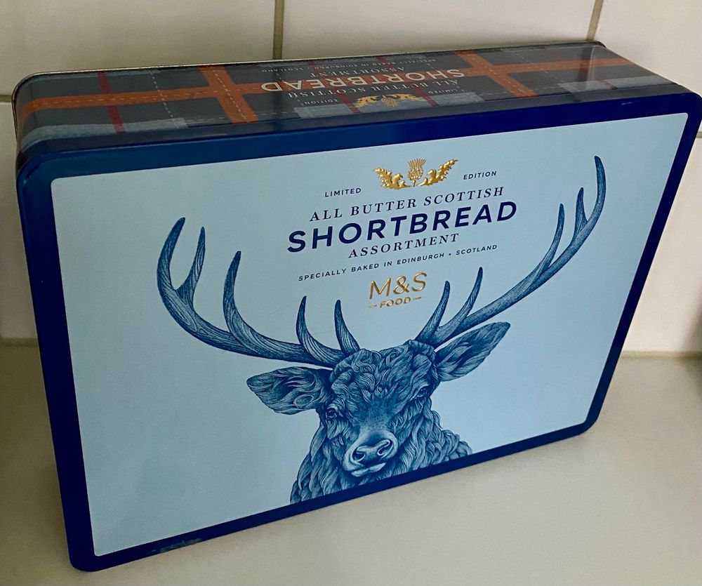 Louis blue tin box with a decorated with a stag