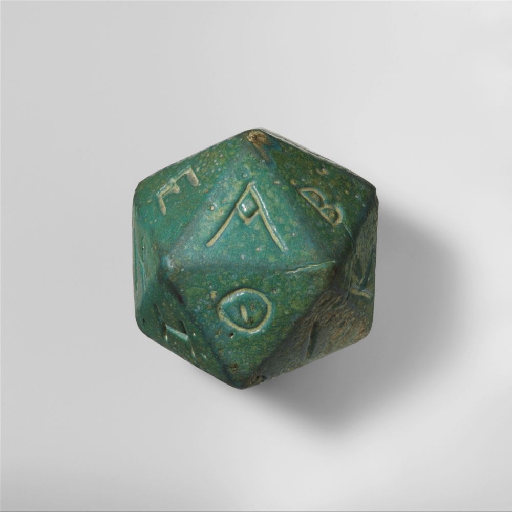 Faience polyhedron inscribed with letters of the Greek alphabet. Roman period (2nd–3rd century CE)
MET Museum.