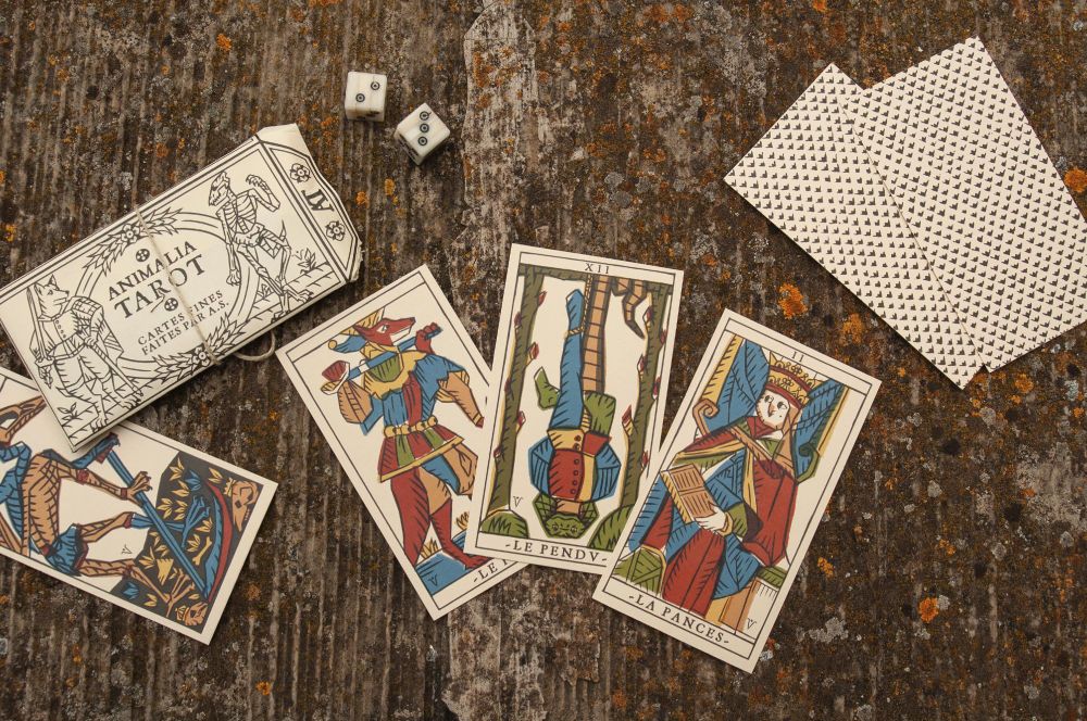 Photo of the Animalia Tarot, a tarot deck featuring the Major Arcana inspired by the Tarot of Marseilles.