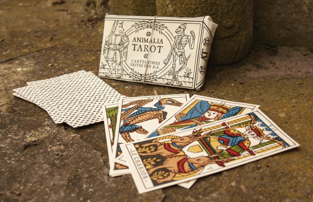 Photo of the Animalia Tarot, a tarot deck featuring the Major Arcana inspired by the Tarot of Marseilles.