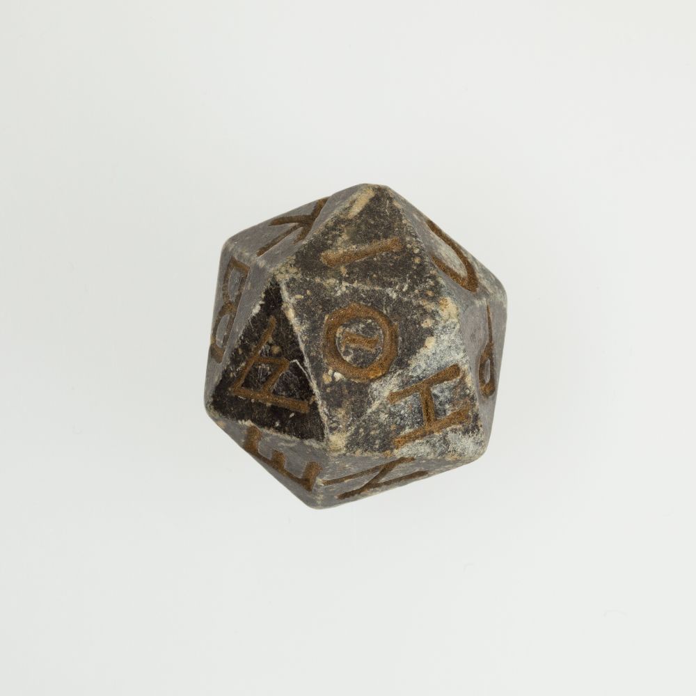 Twenty-sided die (icosahedron) with faces inscribed with Greek letters. Ptolemaic Period–Roman Period. 2nd century B.C.–4th century A.D.
MET Museum.