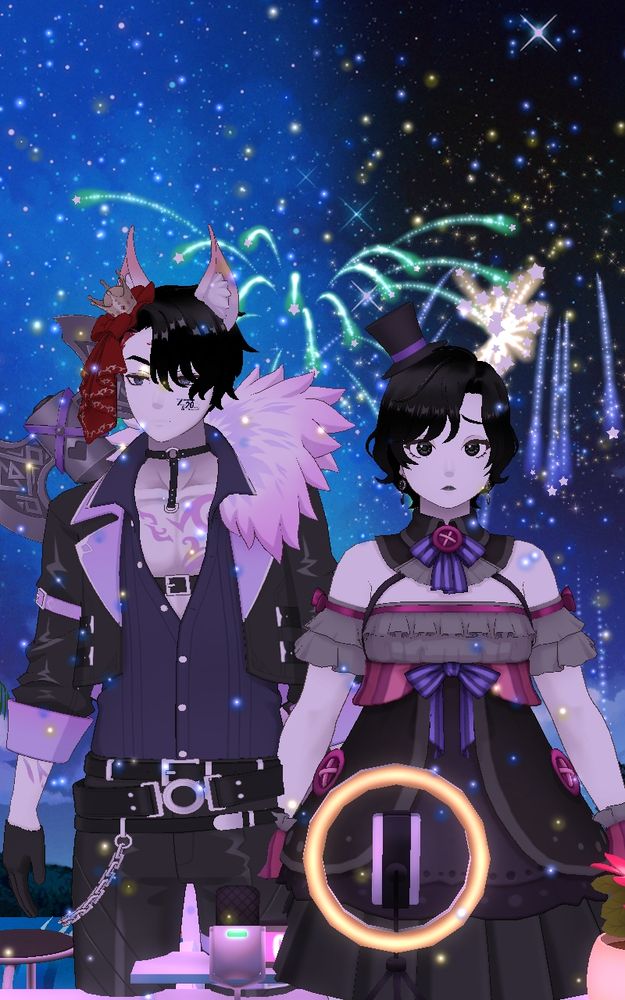 Two vtubers watching the fireworks in the background.