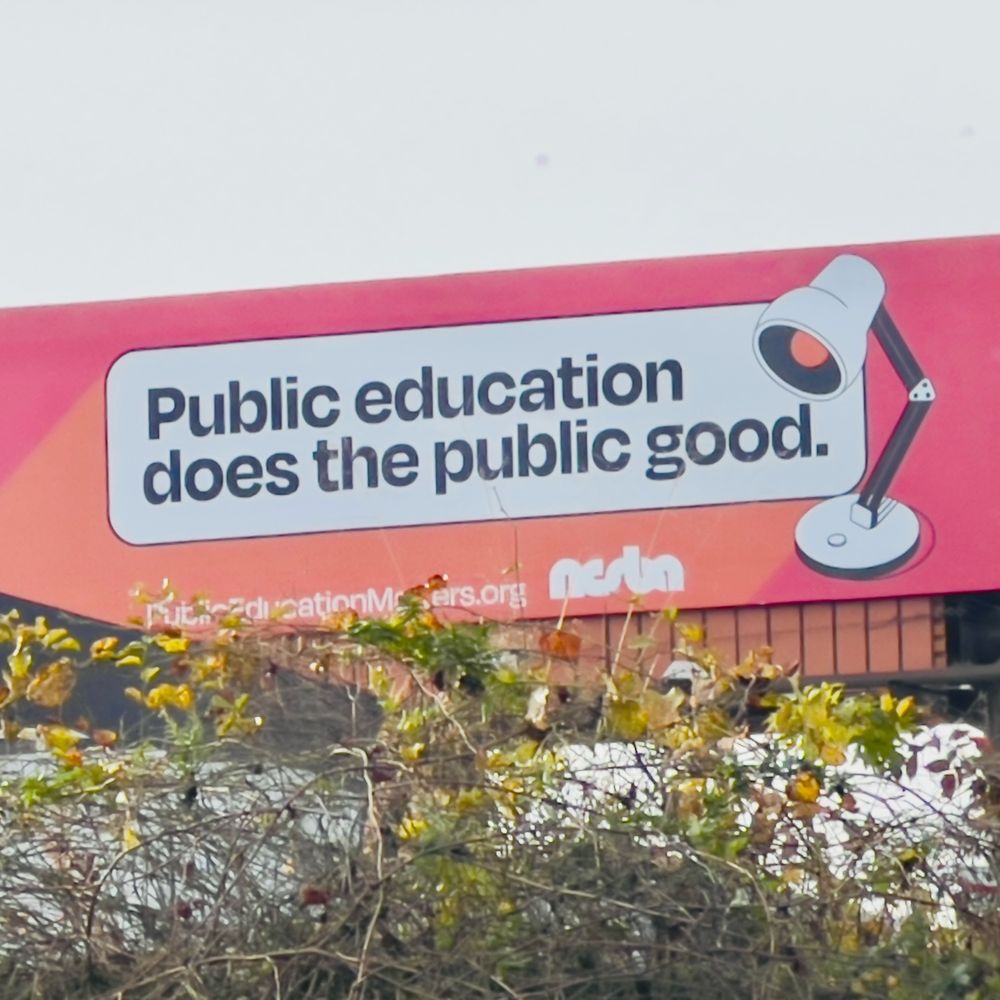 A billboard by the North Carolina School Boards Association reminding us that public education does the public good.