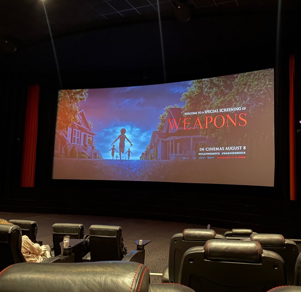 Cinema screen with the words “Welcome to a special screening of Weapons” on it, in the image 3 children are running into the night 