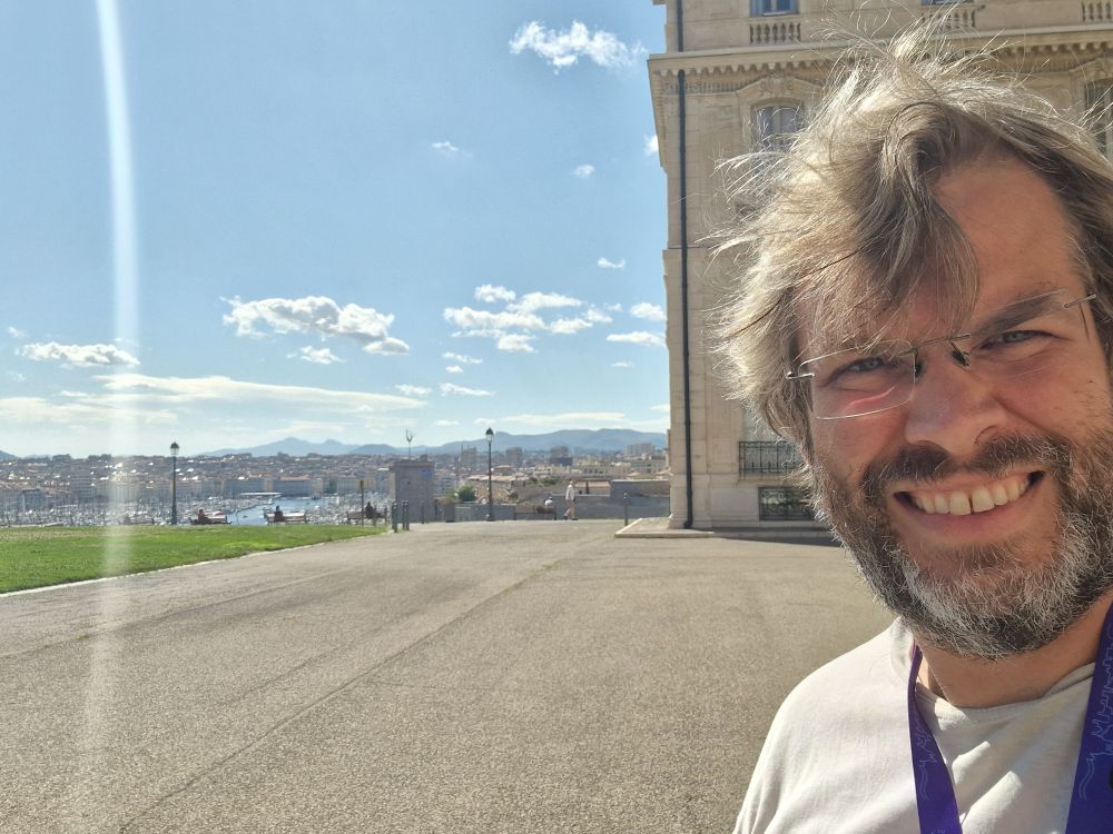 Me, at the conference location. Sunny, and view to the harbour and Mediterranean sea. 