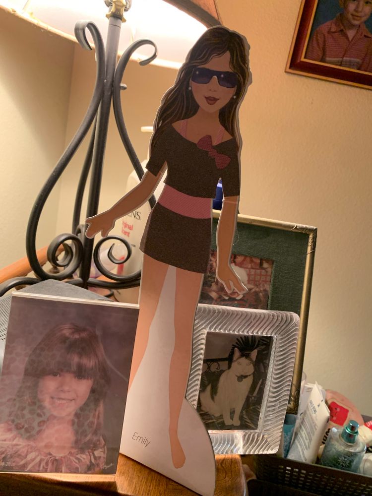 Paper doll, photo of previous pet, weird combo. 
