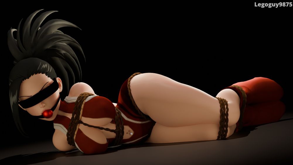 Momo Yaoyorozu tied up in ropes, gagged with a ballgag, and blindfolded. She is laying on her side in a dark room.