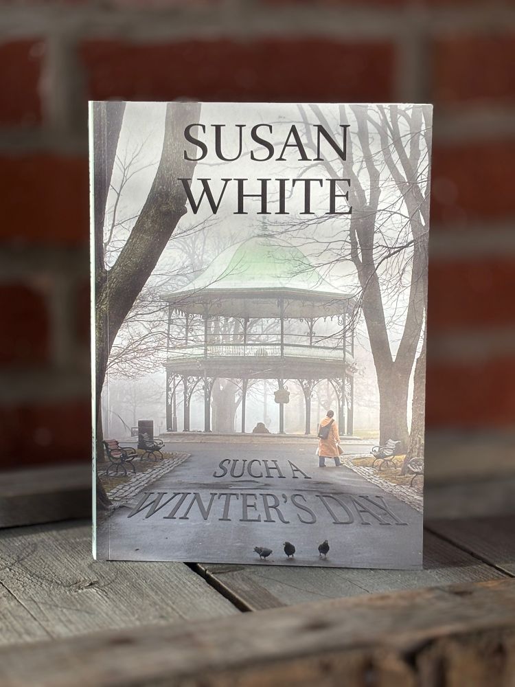 Such a Winter's Day book standing upright on a wood crate with a brick wall blurred in the background.