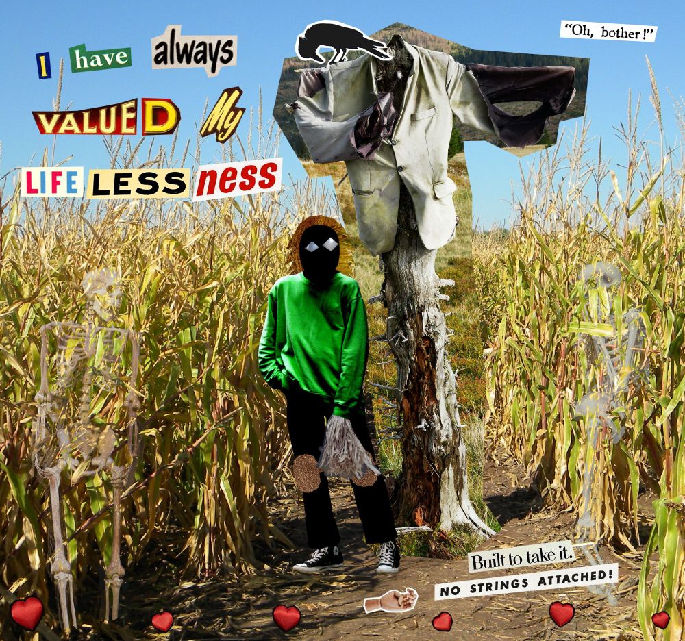 Corn maze under a light blue sky. Fashioned around a birch tree in the center of the path is what remains of a scarecrow: a faded cream-colored overcoat with no hands, legs, or a head. Both sleeves are heavily torn at the elbows, the left flapping across the chest and the right partially draped over its post. A crow with its neck craned down stands on the scarecrow's left shoulder. Two human skeleton props are overlayed on the corn stalks forming the path.

Hatcher (OC) stands to the left of the scarecrow, looking up at it. His mask's diamond-shaped eye holes are cutouts of blue-grey glass gem corn kernels and his hair is a cutout of corn silk. His right arm is limp at his side with long dry corn husks sticking out of the sleeve. A wooden hand sits on the ground in front of him, along with scattered Build-A-Bear hearts. 

Text reads:
“Oh, bother!” (top right corner)
“I have always valued my lifelessness.” (left of Hatcher)
“Built to take it. No strings attached!” (below tree, right of wooden hand)