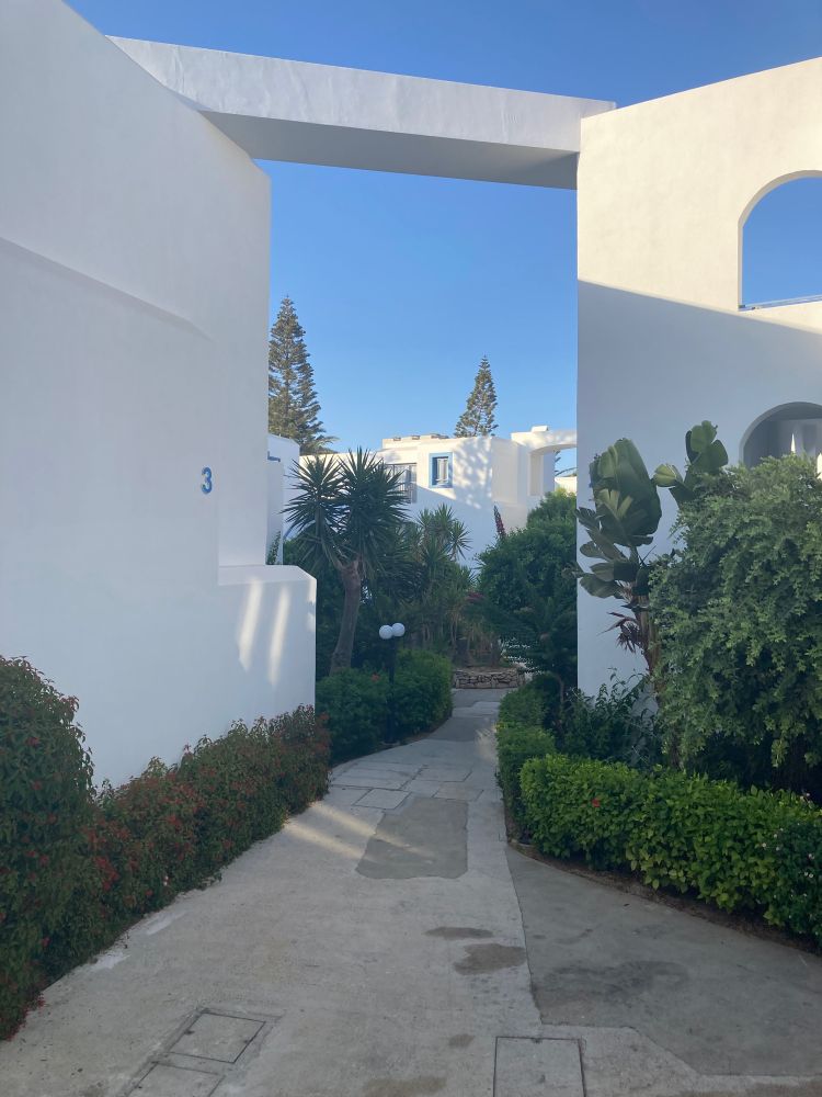 A blocky white building complex, version C.