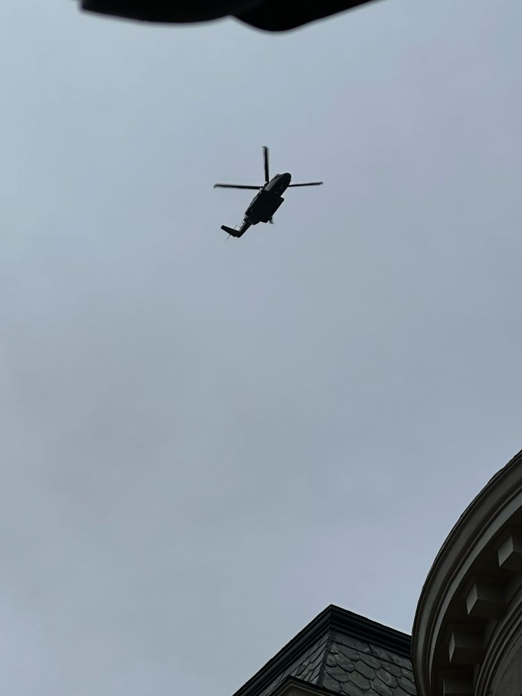 A helicopter flying over townhouses in D.C.