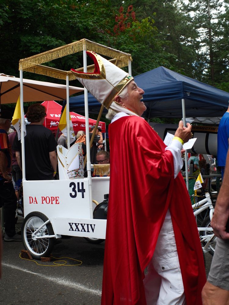 a pope laughing in front of their cart, #34 “Da Pope”