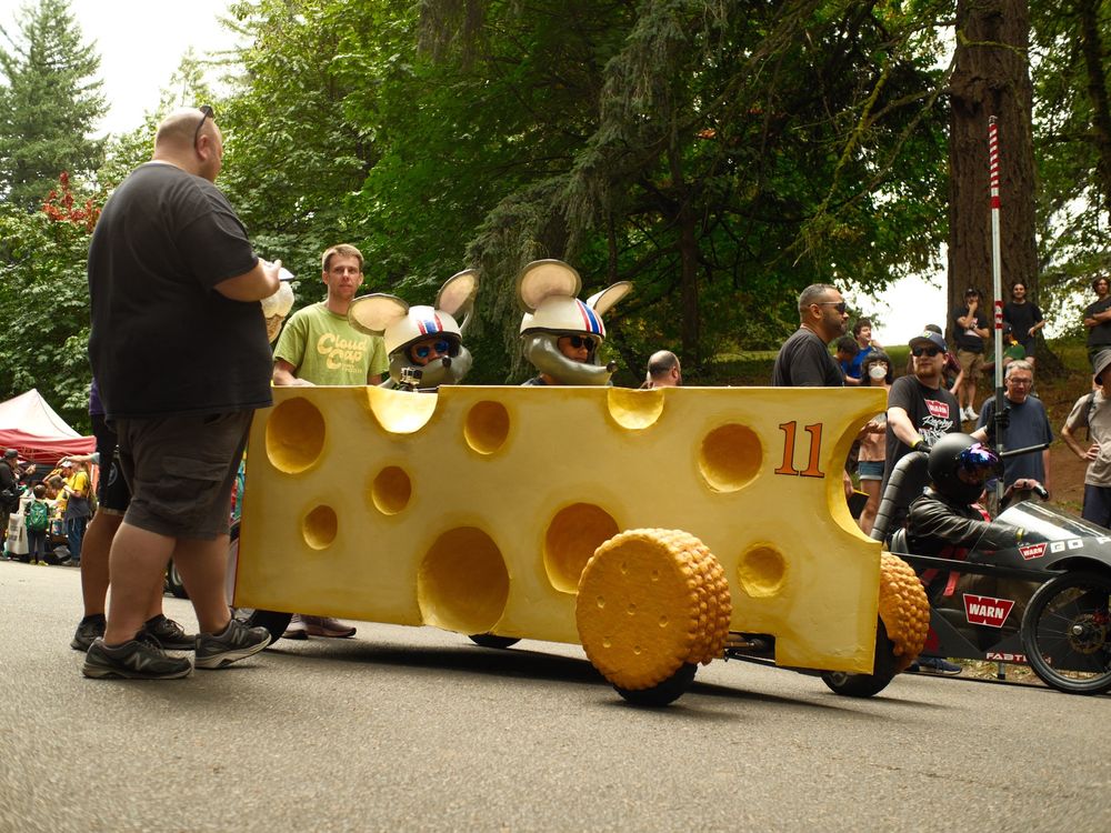 a wedge of cheese piloted by man sized mice