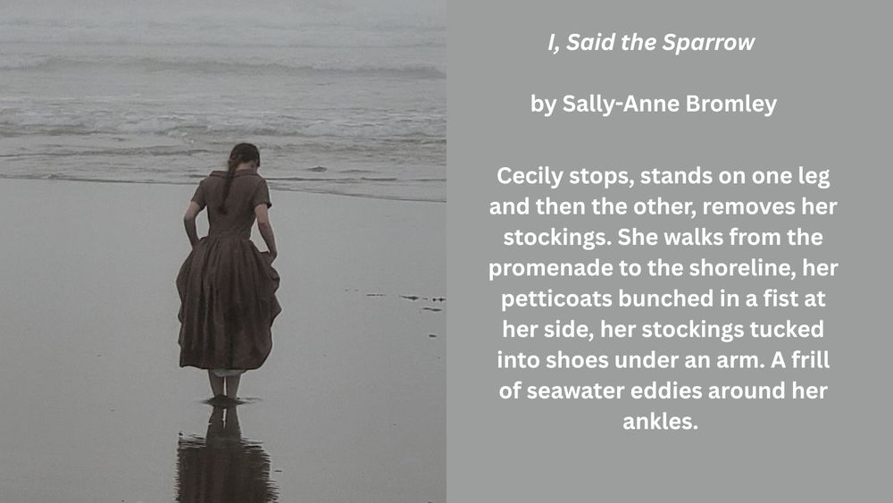 Woman in 1920s dress on the beach. 