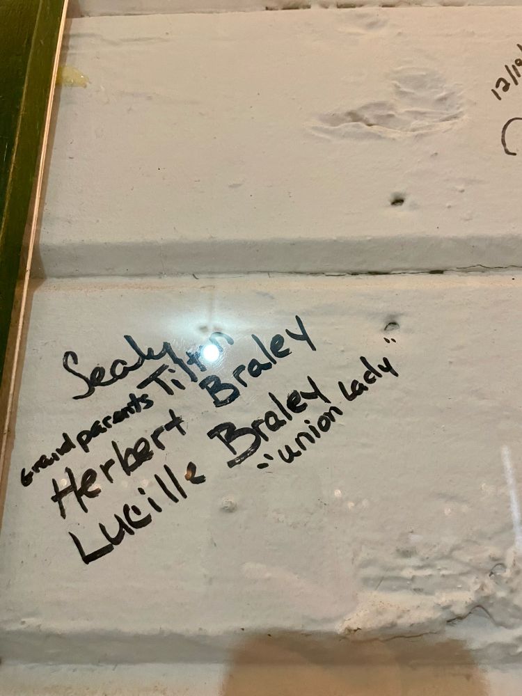 A photo of a wall that workers signed