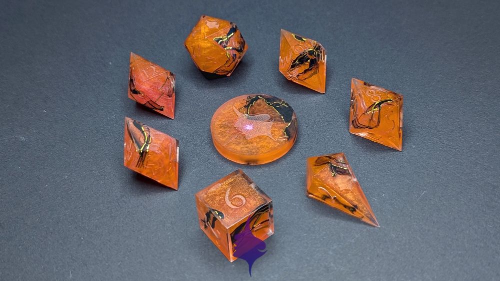 This is a 7 piece set of orange dice. There are black swirls