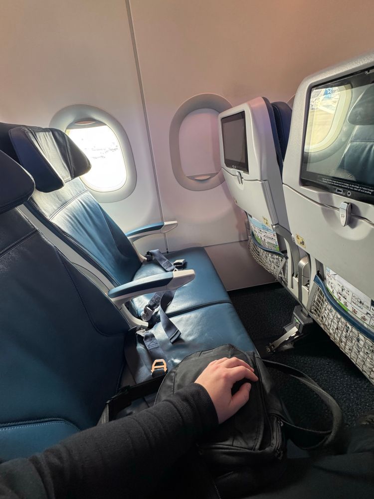 Two empty airplane seats beside me