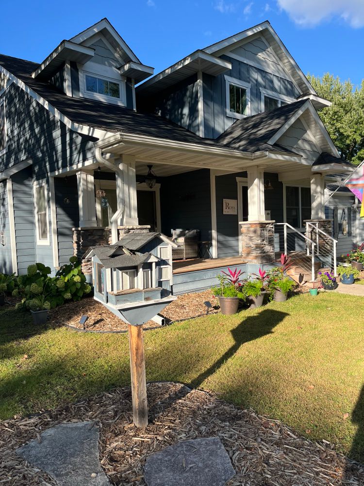 Little free library that matches the house it sits in front of