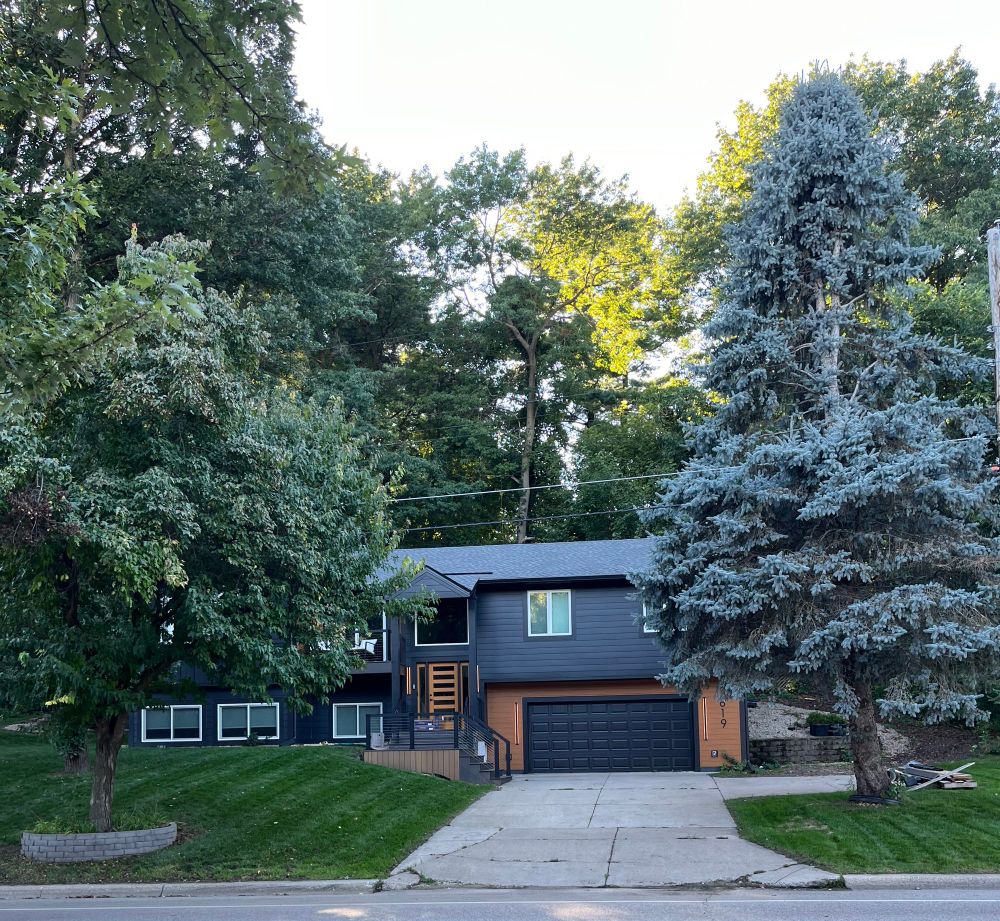 Black house with light wood accents
