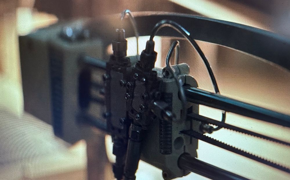 Screenshot of Season 2 Episode 9 of Andor showing a 3D printer that has been altered into prop.