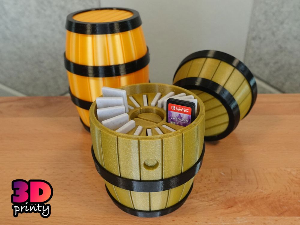 Photo of an open 3D printed Nintendo Switch cartridge organizer containing 17 3D printed demo cartridges and 1 real game cartridge.

The container is shaped like a barrel and the cartridges are arranged in a circle.

Several cartridges are raised for retrieval.