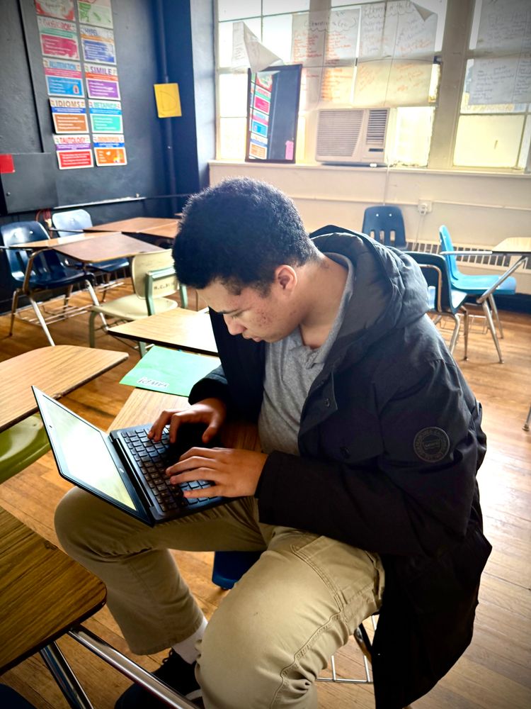 Student works on laptop 
