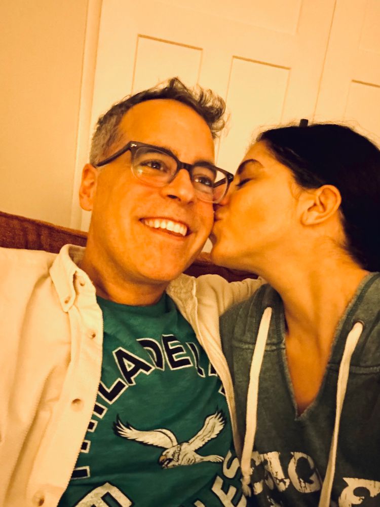 An incredibly handsome Eagles fan gets kissed by his superhot author while joyfully watching the Kansas City Chiefs get humiliated 