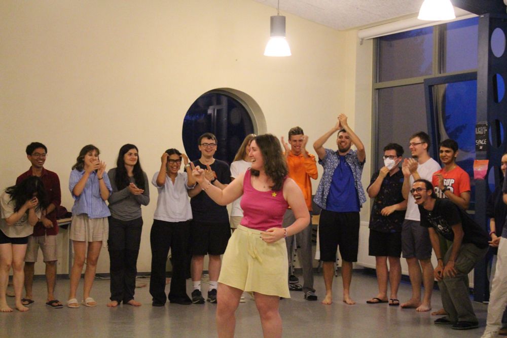 Participants laughing in circle 