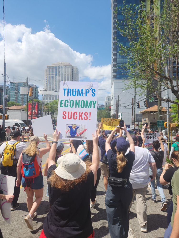 Crowds of protestors marching in Atlanta for the Hands Off protest. 