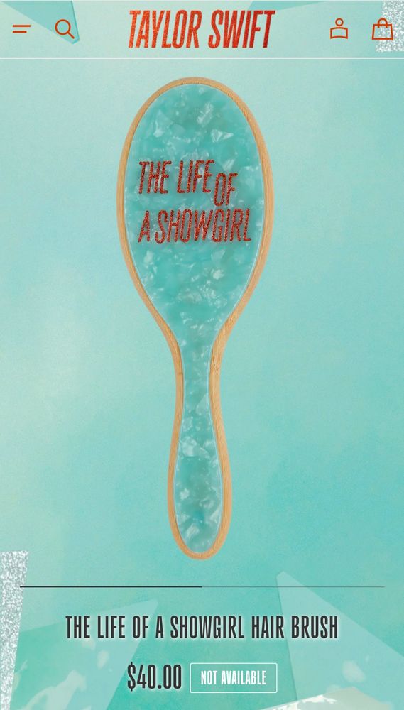 Teal hair brush with the words "the life of a showgirl" in orange on the back. It's  forty dollars and, inexplicably, sold out. 