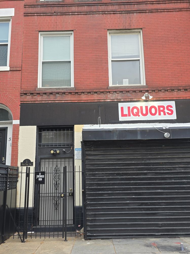 This street-level entrance leads to the building's upper floors.