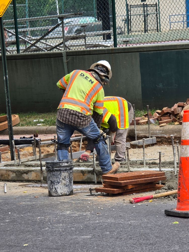 A team replacing some curbs across the street from Dunbar High School.