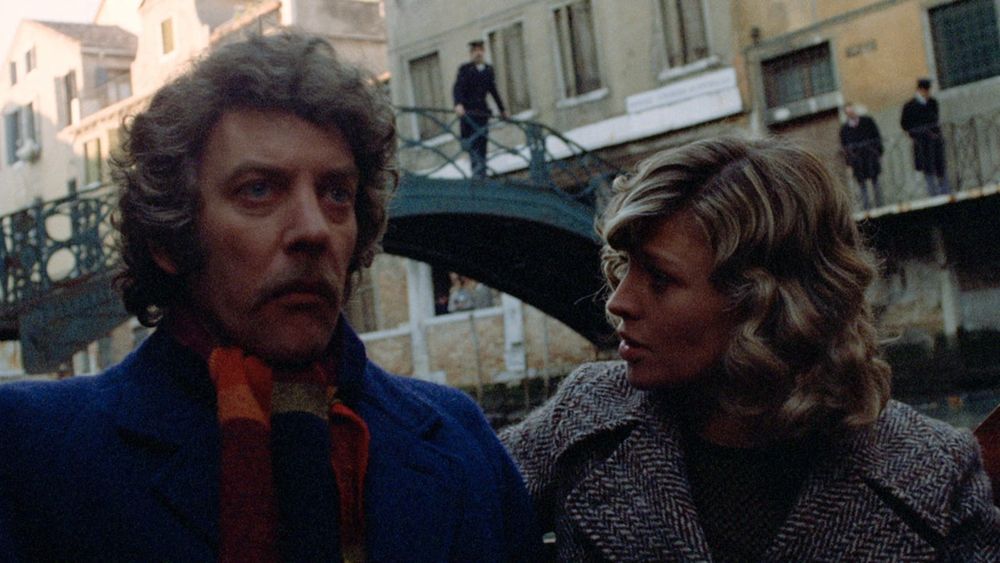 In the canals of Venice, a man sits in a gondola with a very serious expression as a woman looks at him with concern. 

(Image is Donald Sutherland and Julie Christie in Nicolas Roeg's DON'T LOOK NOW.)