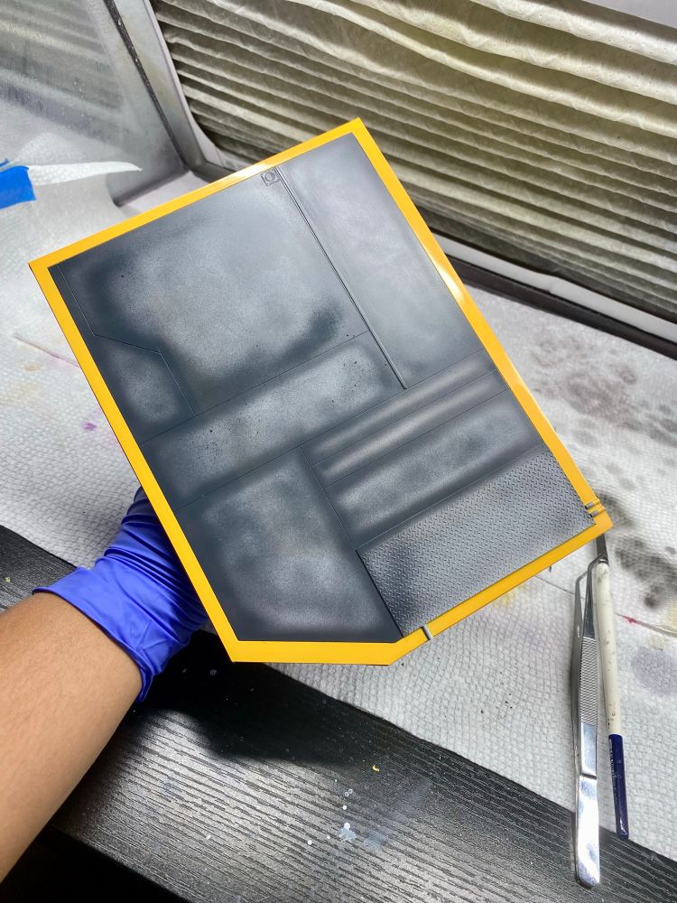 Polygonal base made of styrene with gray, dark gray shading, and yellow edges