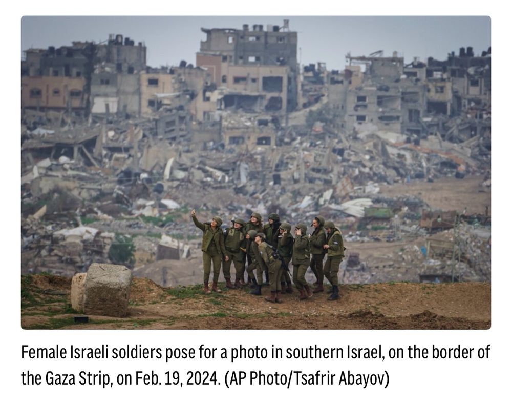 Female Israeli soldiers pose for a photo in southern Israel, on the border of the Gaza Strip, on Feb. 19, 2024. (AP Photo/Tsafrir Abayov)