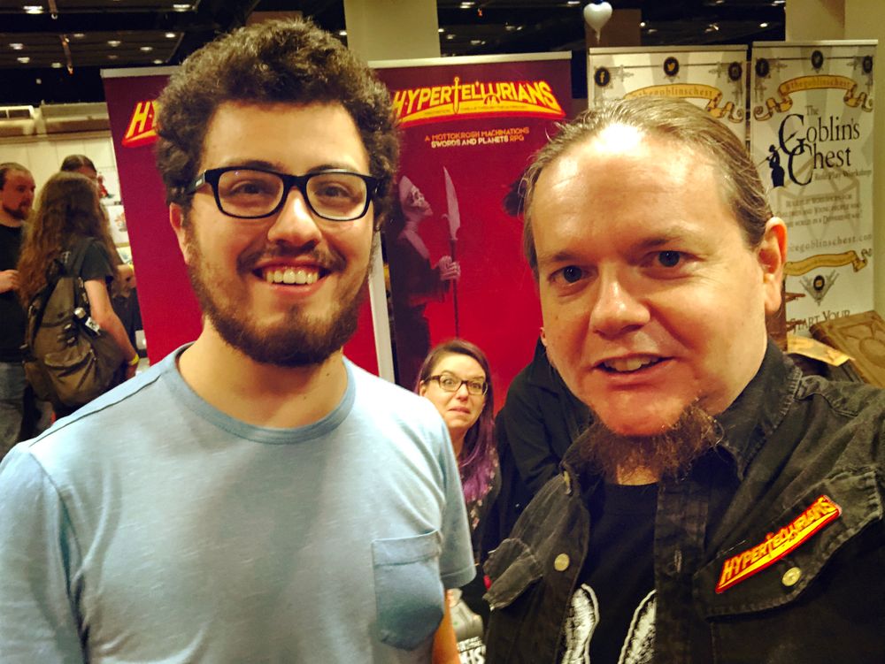 Zach and Frank in front of the Hypertellurians banner.